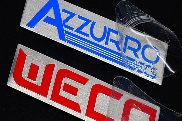 Coated-metal-identification-component-applied-to-products-where-appearance-and-environmental-exposure-must-be-balanced