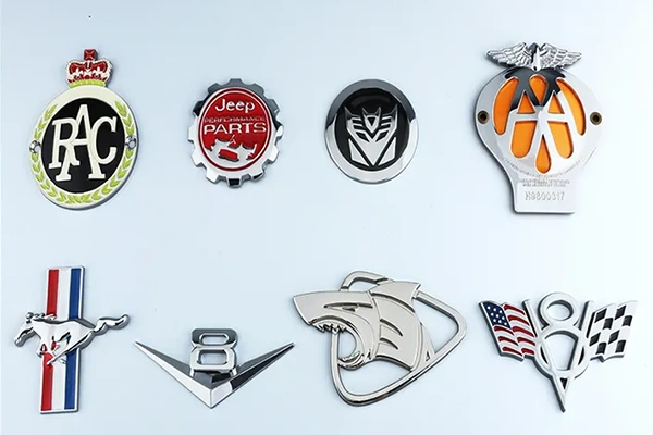Custom metal emblem applications across automotive motorcycle and branded products - Himgo
