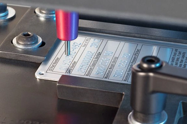 Embossed metal nameplate samples showing relief thickness and finish variation - Himgo
