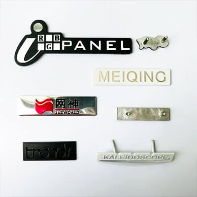 Metal-logo-sticker-applied-on-laptop-surface