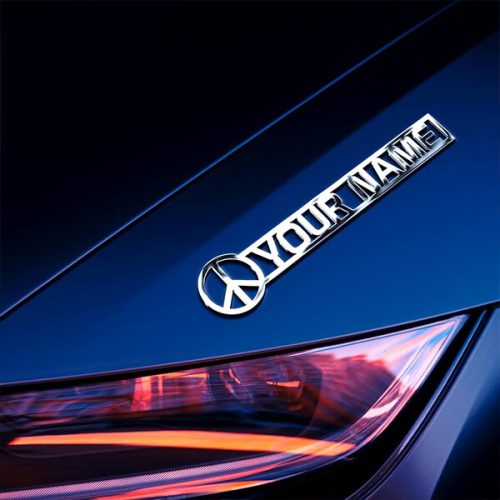Premium-metal-auto-badge-on-black-car-fender