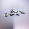 Small-metal-logo-sticker-applied-to-mobile-device