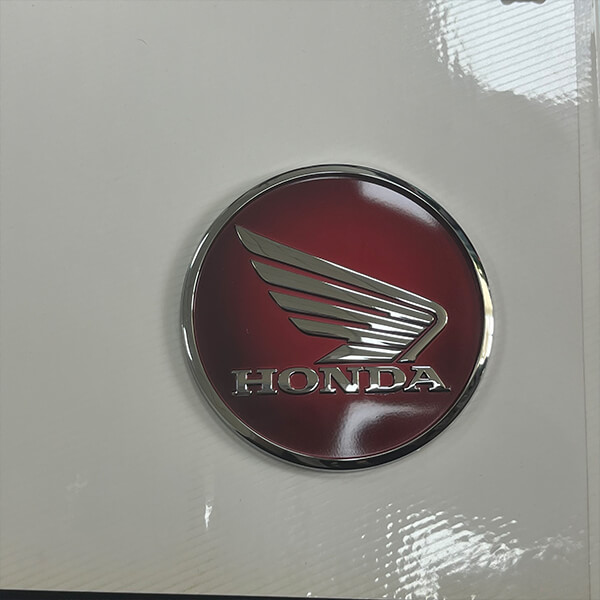 custom-metal-emblem-with-adhesive-backing