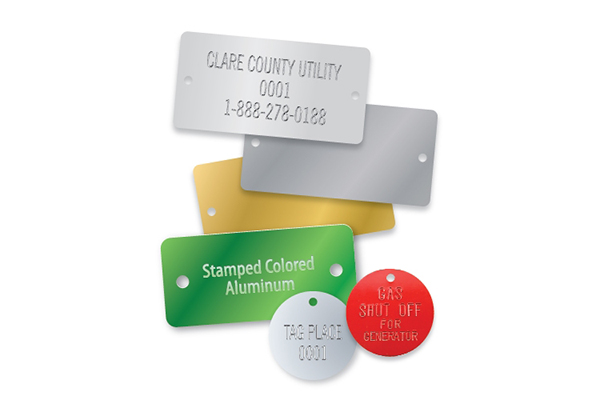 Engraved metal labels with etched text and serial numbers