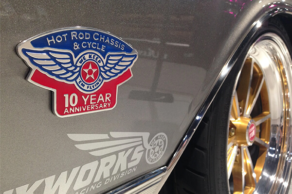 Metal car emblems mounted on vehicle body – durable branding solutions by Himgo