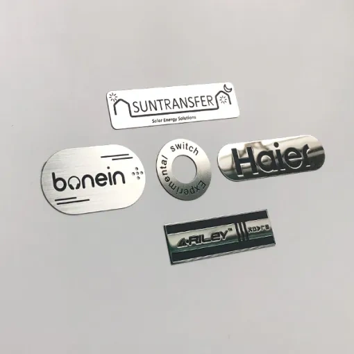 Adhesive-backed metal logo plate for branded equipment panel - Himgo