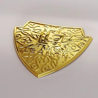 Custom shaped 3D metal emblems for appliance machinery and brand hardware