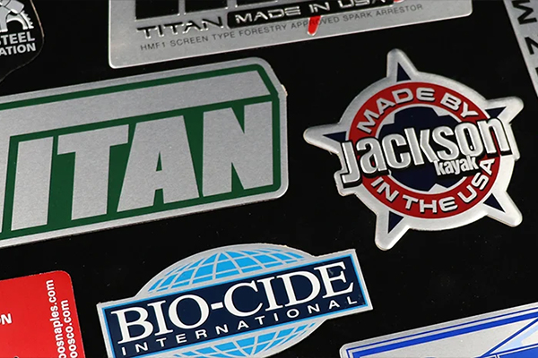 Embossed metal nameplates with raised and recessed details - Himgo