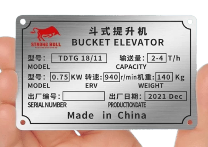 Riveted metal label on heavy machinery panel - Himgo