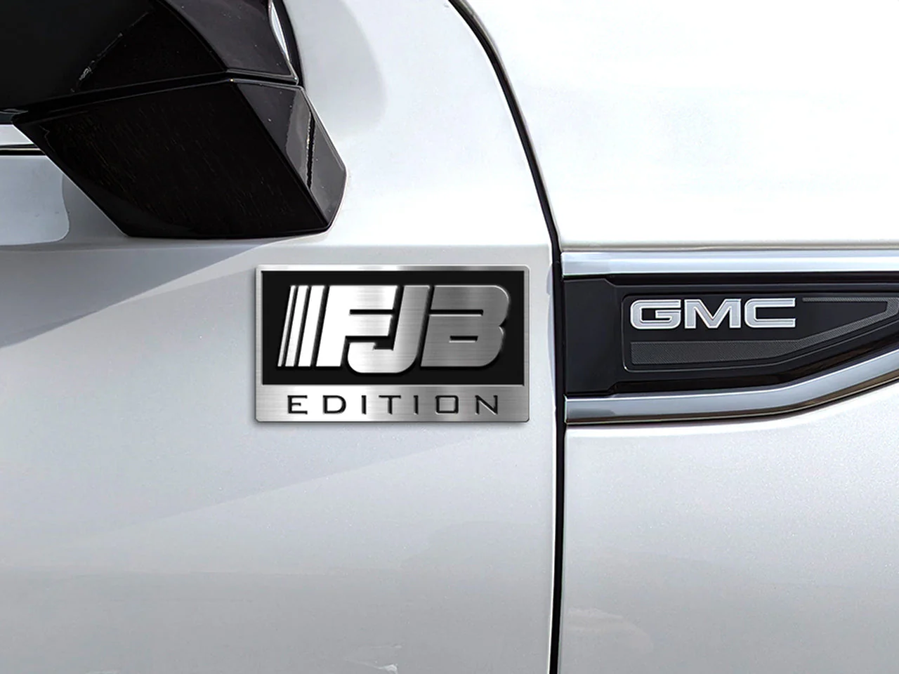 Side profile of zinc alloy 3D metal emblem showing raised relief